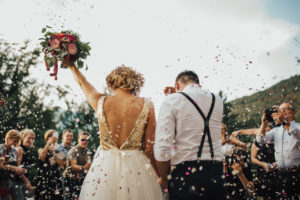 Outdoor wedding after the ceremony with confetti